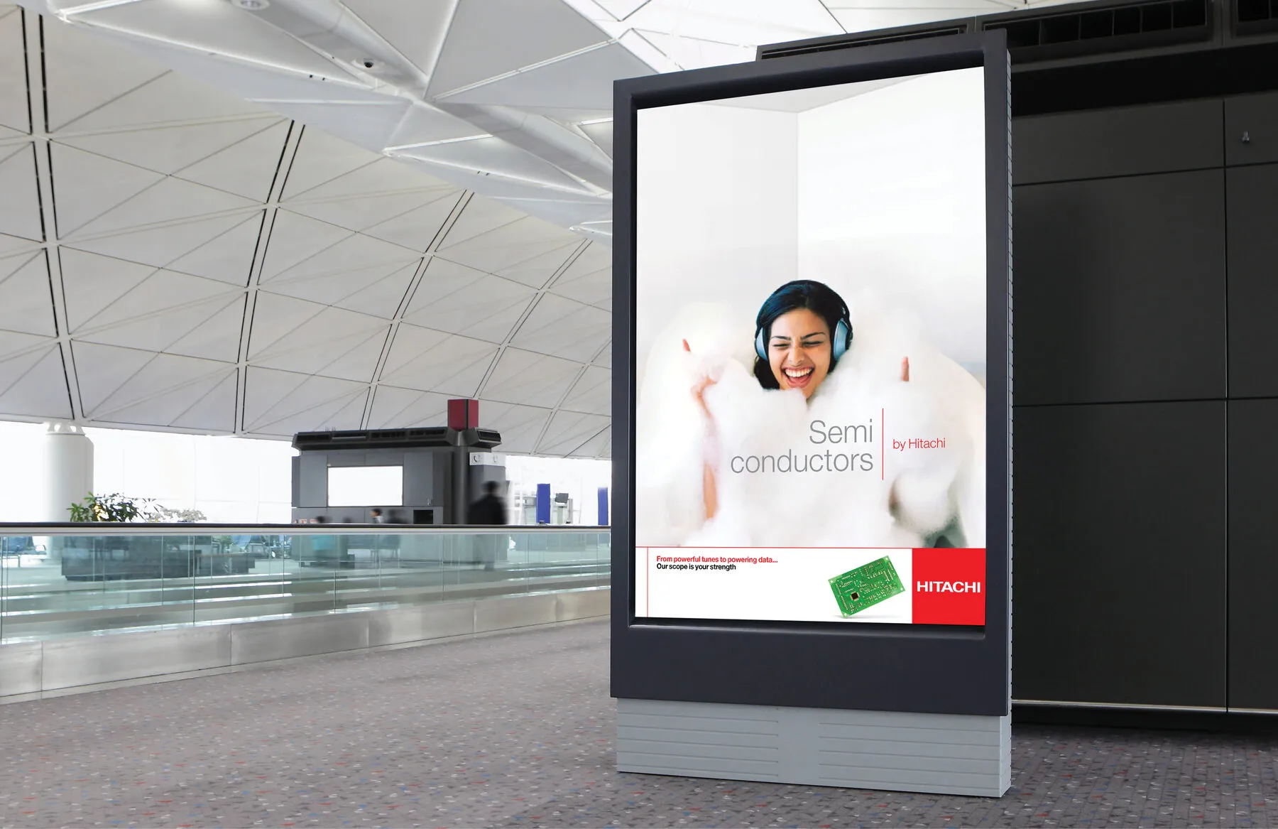 ‘Semi conductors by Hitachi’ billboard in an airport
